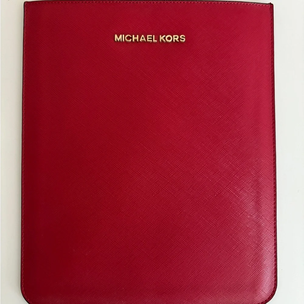 Michael Kors case for the IPad mini. Only used once or twice. 8” X 6 1/4”